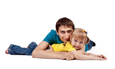 Image showing dad and little daughter lying on the floor