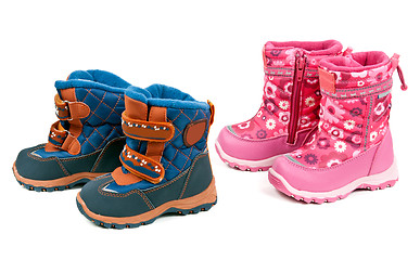 Image showing Two pairs of baby blue and pink boots