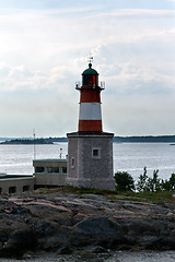 Image showing lonely lighthouse on a rock