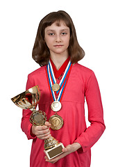 Image showing Girl with gold medals and a cup