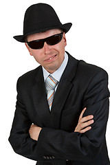 Image showing businessman in dark glasses and a hat