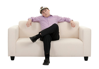 Image showing Serious young boy wearing a cap captain