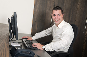 Image showing Male worker at a helpdesk