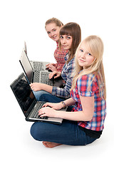 Image showing Three girls with laptops