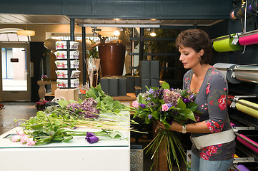 Image showing Florist working in a store