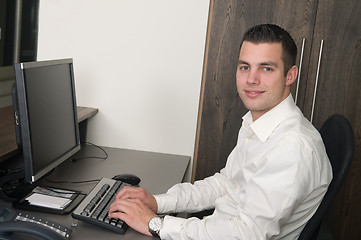 Image showing Male worker at a helpdesk