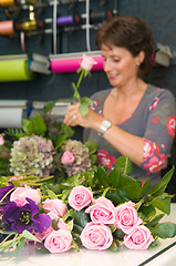 Image showing Florist working in a store