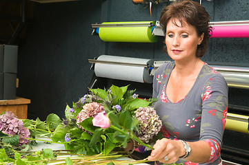 Image showing Florist working in a store