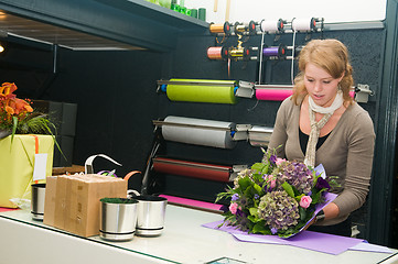 Image showing Florist working in a store