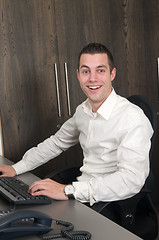 Image showing Male worker at a helpdesk