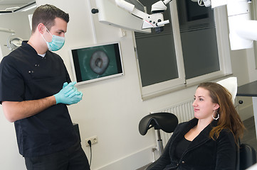 Image showing Dentist and his patient