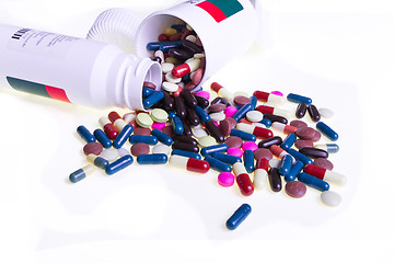 Image showing pills spilling out of container 