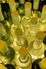 Image showing wine bottles stacked up