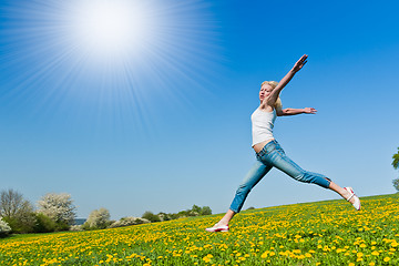 Image showing happy young woman on meadow