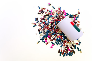 Image showing pills spilling out of container 