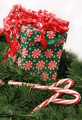 Image showing Christmas box on garland and candy canes