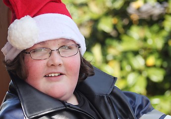 Image showing Young man wearing Santa hat