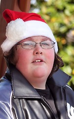 Image showing Young man wearing Santa hat