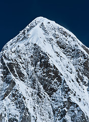 Image showing Himalayas: Pumori peak and blue sky