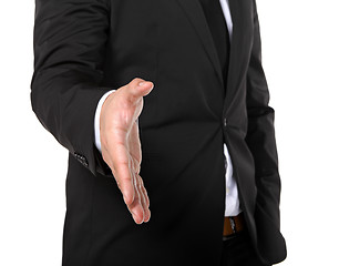 Image showing business man extending hand to shake