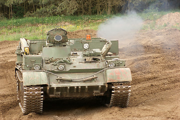 Image showing offroad scenery with driving tank