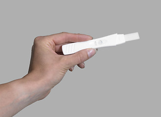 Image showing hand holding a pregnancy test