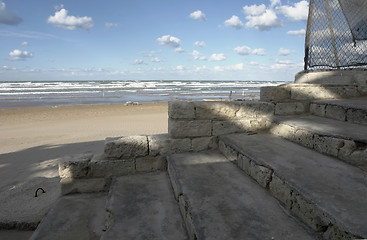 Image showing shady stairs and sunny beach