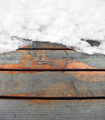 Image showing partly snow covered wooden boards