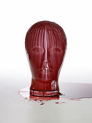 Image showing bloody glass head