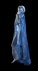 Image showing blue bodypainted woman and fabrics