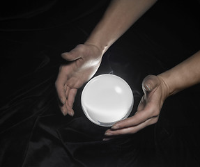 Image showing crystal ball and hands around