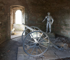 Image showing knightÂ´s armor and cannon