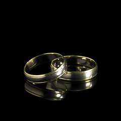 Image showing wedding rings in black back