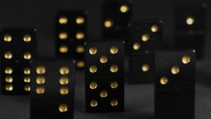 Image showing black dominoes with golden spots