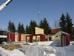 Image showing wooden house construction in sunny ambiance