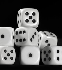 Image showing white dice in black back