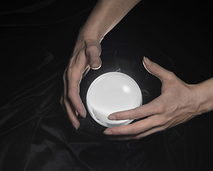 Image showing crystal ball and hands around