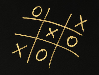 Image showing Hand-drawn tic-tac-toe game over black