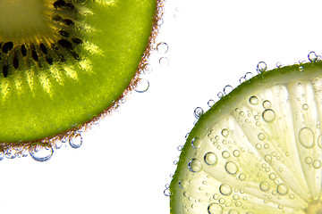 Image showing Lemon and kiwi slices with bubbles 