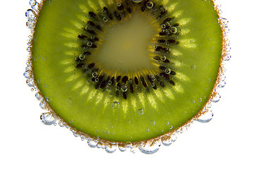 Image showing Close-up of a kiwi slice with bubbles 