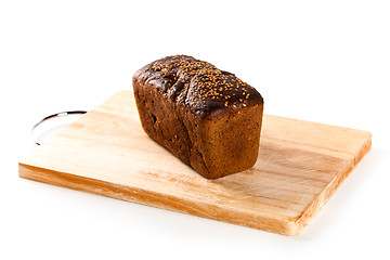 Image showing fresh bread on the wooden board 