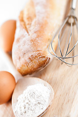 Image showing bread, flour, eggs and kitchen utensil 