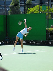 Image showing Female Tennis player serving