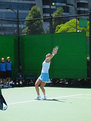 Image showing Female Tennis player serving