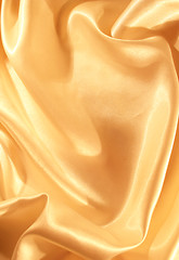 Image showing Smooth elegant golden silk as background