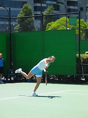 Image showing Female Tennis player serving