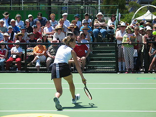 Image showing Female tennis player and spectators