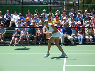 Image showing Female tennis player and spectators