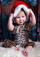 Image showing Little boy dresses up santa's hat