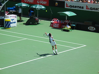 Image showing Male tennis player serving